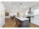 Spacious kitchen with a breakfast bar island, stainless steel appliances, and an open dining area at 4317 N Park Ave, Indianapolis, IN 46205