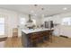 Modern kitchen with stainless steel appliances, white cabinetry, and large center island at 4317 N Park Ave, Indianapolis, IN 46205