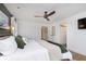 Comfortable bedroom with a ceiling fan, hardwood floors, and a view of the closet at 4317 N Park Ave, Indianapolis, IN 46205