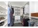 Organized walk-in closet with custom shelving, rods, and drawers for ample storage space at 4317 N Park Ave, Indianapolis, IN 46205