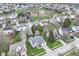 Aerial view of the neighborhood showcasing manicured lawns, mature trees, and well-spaced homes at 5300 Breakers Way, Carmel, IN 46033