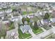 Wide aerial shot of the neighborhood, highlighting the home's location, landscaping, and community features at 5300 Breakers Way, Carmel, IN 46033