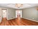 Spacious bedroom featuring wood floors and ensuite bathroom with a beautiful view through the open doorway at 5300 Breakers Way, Carmel, IN 46033