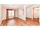 Bright dining area featuring hardwood floors, a modern chandelier, and natural light at 5300 Breakers Way, Carmel, IN 46033