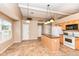 Spacious kitchen featuring an island, ample cabinet space, tile flooring, and modern appliances at 5300 Breakers Way, Carmel, IN 46033