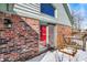 Brick house backyard featuring a glass sliding door with a snow-covered deck at 60 Huddleston N Dr, Indianapolis, IN 46217