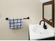 Close-up of a white sink and dark wood framed mirror in a half bathroom at 60 Huddleston N Dr, Indianapolis, IN 46217