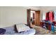 Bedroom featuring wood laminate flooring with a view to the living room at 60 Huddleston N Dr, Indianapolis, IN 46217
