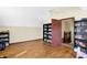 Bright bedroom with hardwood floors and built-in bookshelves at 60 Huddleston N Dr, Indianapolis, IN 46217
