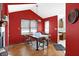 Cozy dining room with hardwood floors, chandelier, and abundant natural light at 60 Huddleston N Dr, Indianapolis, IN 46217