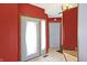 Inviting entryway with warm red walls and a stylish front door at 60 Huddleston N Dr, Indianapolis, IN 46217