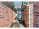 Close-up of the front door entrance with brick surround and small step at 60 Huddleston N Dr, Indianapolis, IN 46217