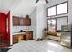 Eat-in kitchen area with upper wood cabinets, stainless steel refrigerator, and large windows at 60 Huddleston N Dr, Indianapolis, IN 46217