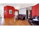 Inviting living room featuring hardwood floors, vaulted ceilings, and a cozy seating area at 60 Huddleston N Dr, Indianapolis, IN 46217