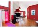 Open-concept living space with vaulted ceilings and rich hardwood floors at 60 Huddleston N Dr, Indianapolis, IN 46217