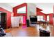 Spacious living room with vaulted ceilings, hardwood floors, and bright windows at 60 Huddleston N Dr, Indianapolis, IN 46217