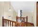 A stairway area with wooden railing and open shelving provides storage at 60 Huddleston N Dr, Indianapolis, IN 46217