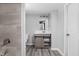 Bright bathroom featuring modern vanity, updated lighting and tiled shower with glass door at 6205 Beech Grove Rd, Martinsville, IN 46151