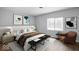 Cozy bedroom featuring a large window, accent chair and comfortable king bed at 6205 Beech Grove Rd, Martinsville, IN 46151