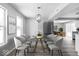 Modern dining room with a glass table and contemporary chairs at 6205 Beech Grove Rd, Martinsville, IN 46151