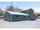 Exterior of a two-story home with blue siding in a snowy landscape at 6205 Beech Grove Rd, Martinsville, IN 46151
