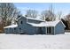 Exterior of a two-story home with blue siding in a snowy landscape at 6205 Beech Grove Rd, Martinsville, IN 46151