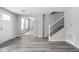 Open-concept living room with natural light and vinyl flooring at 6205 Beech Grove Rd, Martinsville, IN 46151