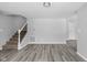 Spacious living room with vinyl flooring and stairway at 6205 Beech Grove Rd, Martinsville, IN 46151