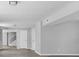 Expansive Living Room with grey flooring, fresh paint, and lots of natural light at 6205 Beech Grove Rd, Martinsville, IN 46151