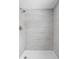 Luxurious shower with white marble tile surround and modern fixtures at 6205 Beech Grove Rd, Martinsville, IN 46151