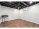 Unfinished basement with laminate flooring at 633 E 32Nd St, Indianapolis, IN 46205