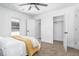 Bedroom with a ceiling fan, neutral carpet, and open closet space at 633 E 32Nd St, Indianapolis, IN 46205