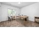 Bright bedroom with a large window, carpeted floors, and a desk with modern decor at 633 E 32Nd St, Indianapolis, IN 46205