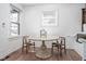 Dining room with a round table, wooden chairs, and built-in bench seating at 633 E 32Nd St, Indianapolis, IN 46205