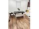 Dining room with a rustic table, comfortable seating, and hardwood floors at 633 E 32Nd St, Indianapolis, IN 46205