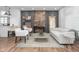 Bright living room with hardwood floors, white sofa, exposed brick accent wall, and stylish decor at 633 E 32Nd St, Indianapolis, IN 46205