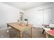 Bright office with a large desk, carpeted floors, and a window at 633 E 32Nd St, Indianapolis, IN 46205