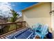 Inviting back deck with blue chairs, ideal for relaxing and enjoying the outdoor view at 6348 Bay Vista E Dr, Indianapolis, IN 46250