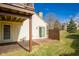 View of the home's backyard featuring a small patio and open green space at 6348 Bay Vista E Dr, Indianapolis, IN 46250