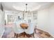Bright dining area featuring a round table, stylish chairs, and natural light from large windows at 6348 Bay Vista E Dr, Indianapolis, IN 46250
