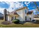 Charming home showcasing a stone chimney and vinyl siding with a neatly maintained front yard and blue skies at 6348 Bay Vista E Dr, Indianapolis, IN 46250