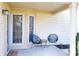 Inviting front porch featuring stylish seating, a neutral color scheme and a welcoming ambiance at 6348 Bay Vista E Dr, Indianapolis, IN 46250
