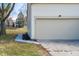 Attached one car garage and concrete driveway. The house number is clearly displayed on the siding at 6348 Bay Vista E Dr, Indianapolis, IN 46250