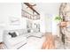 Open living space showcasing a stone fireplace, hardwood floors, and a spacious layout at 6348 Bay Vista E Dr, Indianapolis, IN 46250