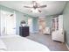Spacious main bedroom with en-suite bathroom, a seating area, and a bookshelf at 6348 Bay Vista E Dr, Indianapolis, IN 46250