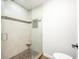 Elegant tiled shower featuring glass enclosure and built-in niche at 6348 Bay Vista E Dr, Indianapolis, IN 46250