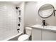 Modern bathroom featuring white subway tile, a vanity and a bathtub at 643 Fort Wayne Ave # B & D, Indianapolis, IN 46204