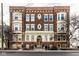 Three story brick apartment building with decorative architectural details at 643 Fort Wayne Ave # B & D, Indianapolis, IN 46204