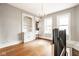 Spacious living room with built-in shelving, hardwood floors, and chandelier at 643 Fort Wayne Ave # B & D, Indianapolis, IN 46204