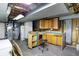 Basement with storage cabinets, workspace, washer/dryer hookups, and utilities at 6838 Hague Rd, Indianapolis, IN 46256